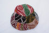 Multicolored patterned fabric patch on a white background